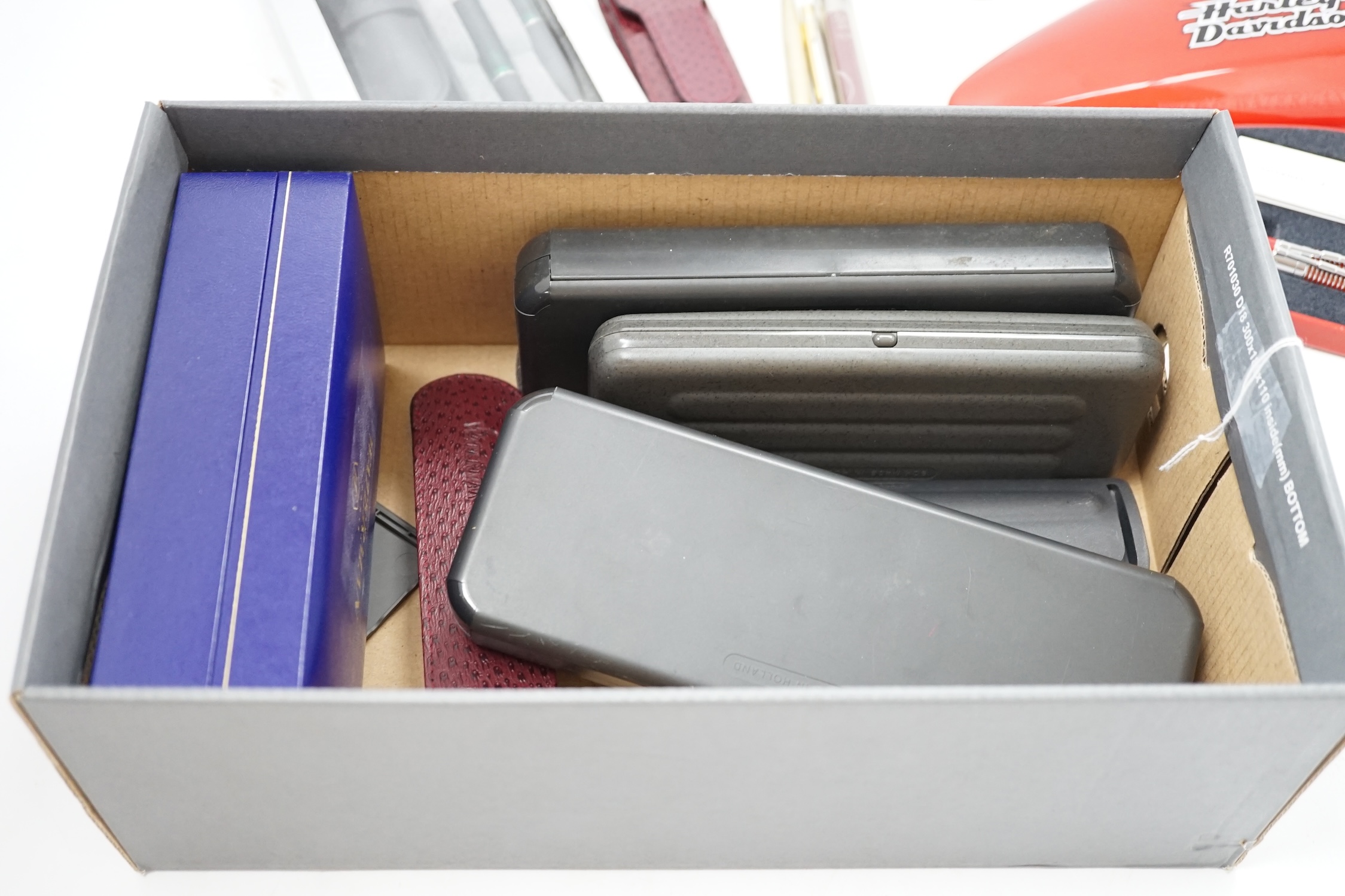 A Parker Duofold, a lapis lazuli fountain and ballpoint pen and a faux greenstone fountain pen, a Waterman Harley Davidson ballpoint pen, and nine other Parker / Waterman pens and pencils. Condition - fair